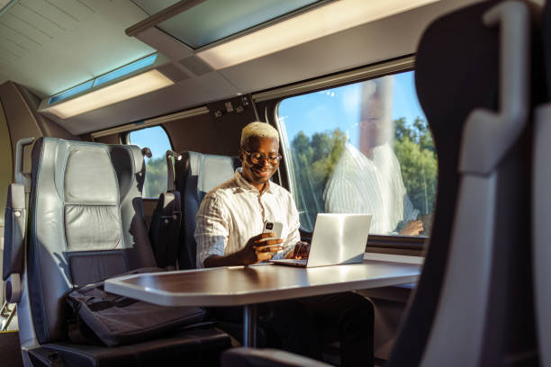istock African American businessman using wireless technology in train 1601254312