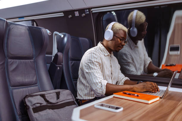 istock African American businessman writing notes in train at night 1601258518
