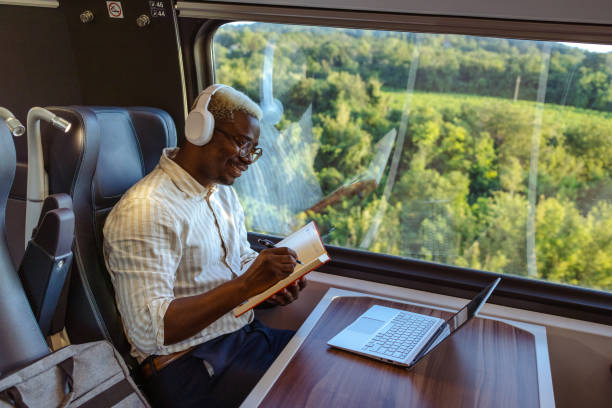 istock African American businessman writing notes in train 1601258519