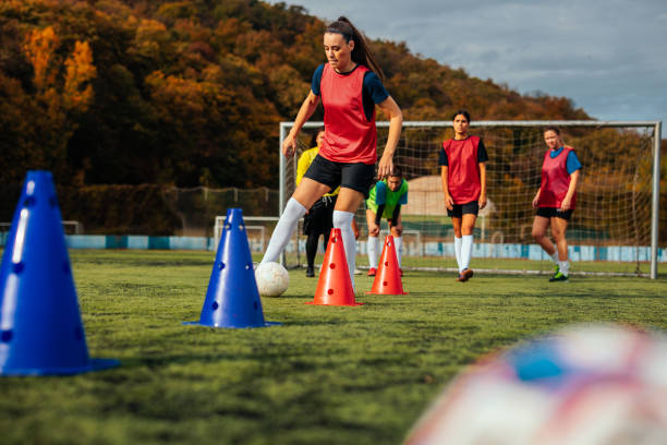 istock Dribbling practice at female soccer club. 1601259048