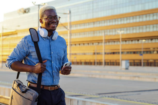 istock Young African American commuter on a train station after work 1601264307