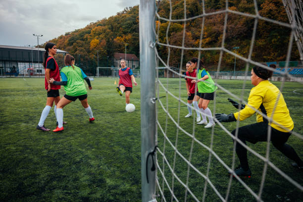 istock Female soccer player shooting on goal in practice. 1601273245