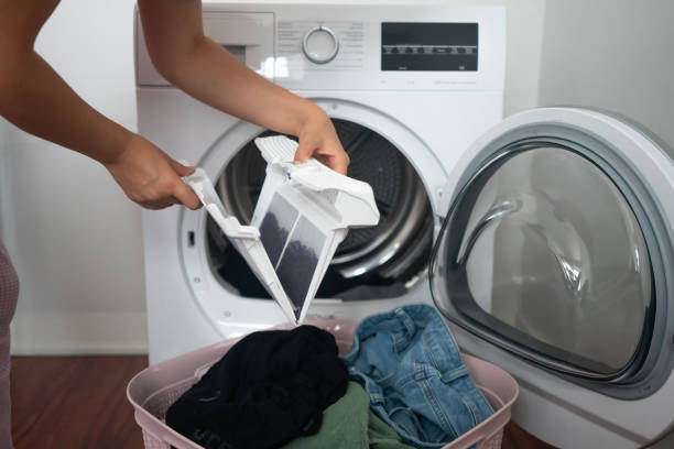 istock A woman holds a dirty dryer filter. 1601282253