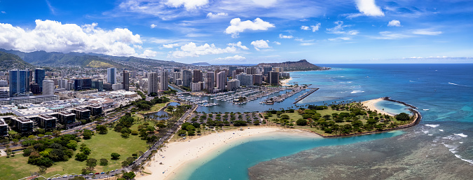 Panoramic view of the densest parts of Honolulu, including Kakaako, Ala Moana beach and condominiums, and Waikiki's hotels and beaches