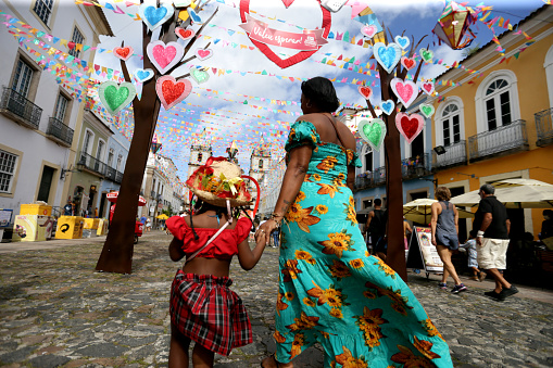 salvador, bahia, brazil - june 26, 2022: children visit the decoration of the feast of Sao Joao in Pelourinho, historic center of the city of Salvador