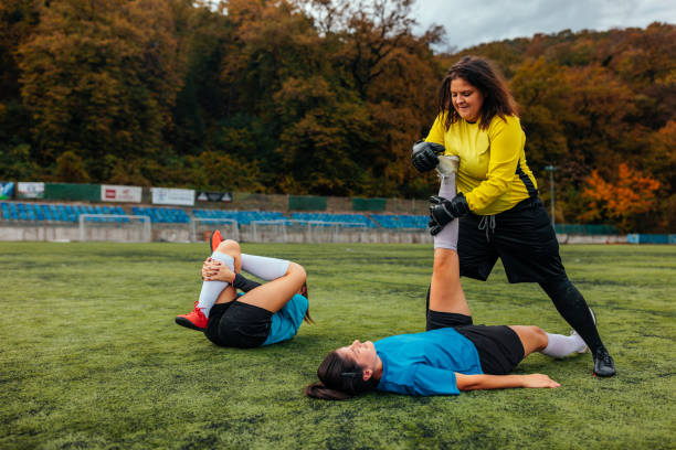 istock Soccer girls stretching in practice. 1601301157