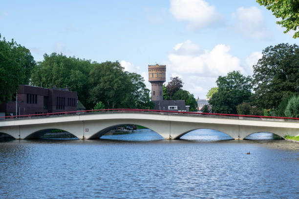 view of the Wilhelminabrug, Parijsebrug, over the canal of Woerden with the striking water tower in the background stock photo