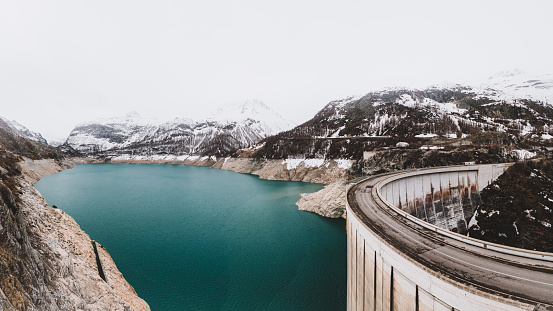 Tignes dam with the Lac du Chevril artificial lake in the Isere valley in Savoie in the French Alps in spring