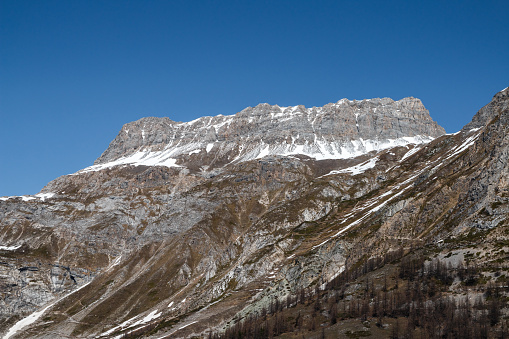 Mountain peaks in the Grande Sassiere national nature reserve. This photo was taken near Val d'Isere, french Alps ski resort village, in Vanoise massif in Haute-Tarentaise, Savoie department in Auvergne-Rhone-Alpes region in France, Europe.