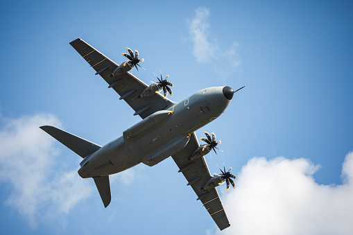 Close-up of a military  A400m Atlas aircraft in Europe, training in the air on a clear summer day.