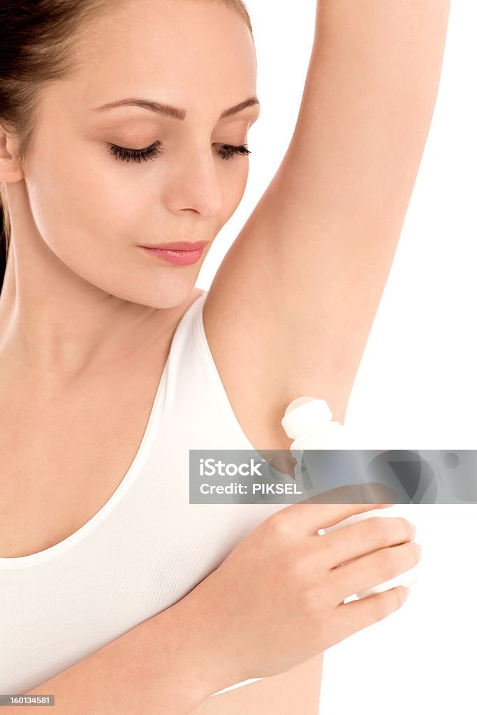 Young woman applying deodorant http://www.edkafelek.com/beauty.jpg Adult Stock Photo