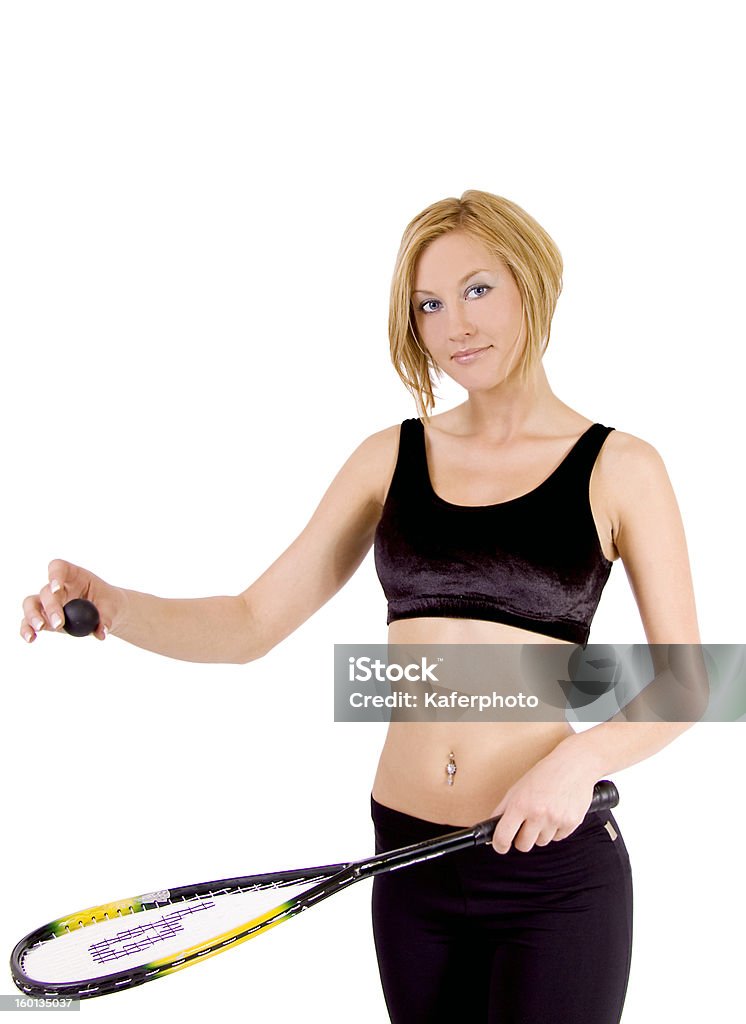 Joven mujer rubia jugando al squash - Foto de stock de 20 a 29 años libre de derechos