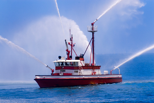 A fireboat spraying its water cannons during a demonstration.