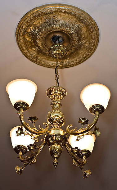 istock Antique chandelier with golden metal structure and white glass elemnts. 160136123