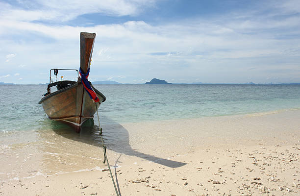 istock Longtail Boat In A Coral Island Bliss 160136356