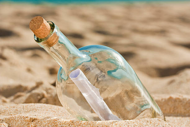 istock Found bottle with a message near the shore 160136532
