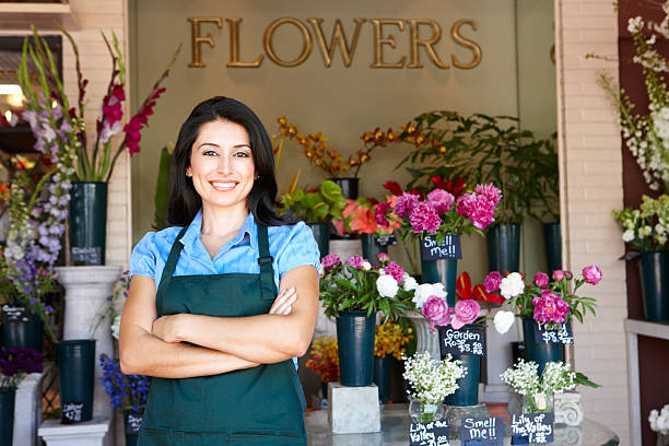 istock Woman standing outside florist 160137268