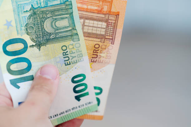 istock Euro banknotes in hand 1601375571