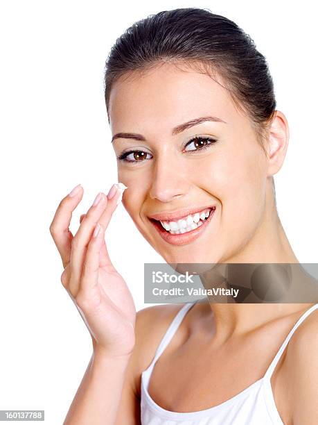 Smiling Woman Applying Moisturizer Cream Stock Photo - Download Image Now - 20-29 Years, Adult, Adults Only