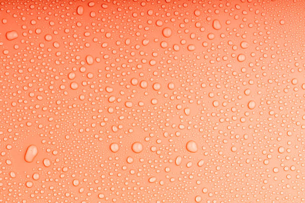 istock small drops of water on the orange surface 1601380888