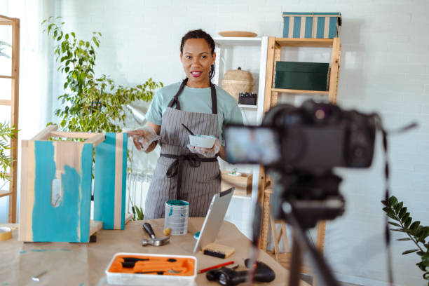 istock African American woman filming video tutorial about woodcraft 1601381956