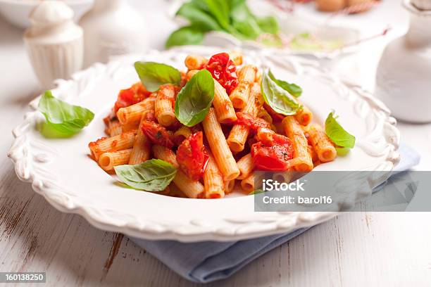 Sedani Rigati Pasta With Cherry Tomatoes And Basil Stock Photo - Download Image Now - Basil, Cherry Tomato, Close-up