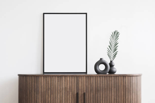 istock Artwork mockup in interior design. Blank picture frame on a wall. Vertical orientation 1601384224