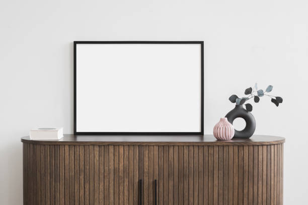 istock Artwork mockup in interior design. Blank picture frame on a wall. Horizontal orientation 1601384227