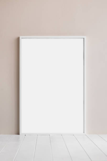 istock Artwork mockup in interior design. Blank picture frame on a wall. Vertical orientation 1601384627
