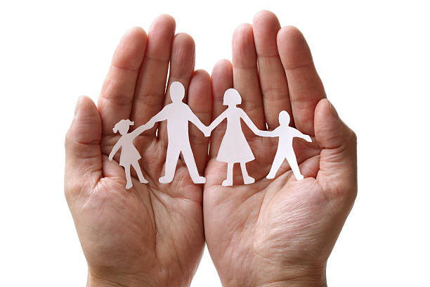 istock Paper chain family protected in cupped hands 160138988