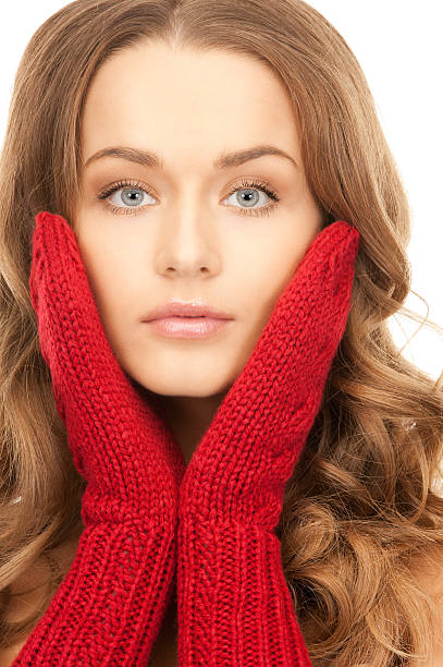 istock beautiful woman in red mittens 160139027
