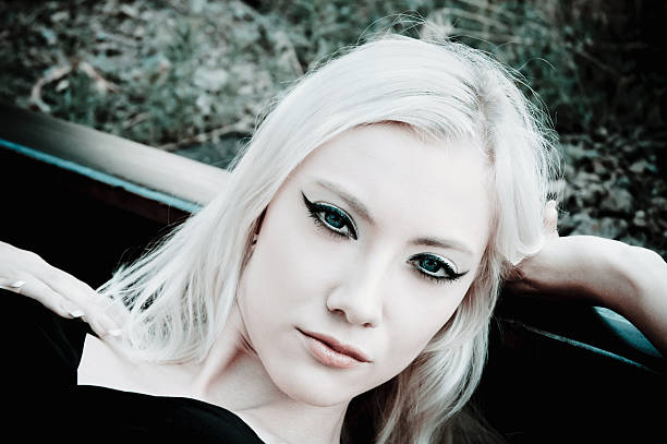 istock Beautiful young girl lying on the rails 160139168