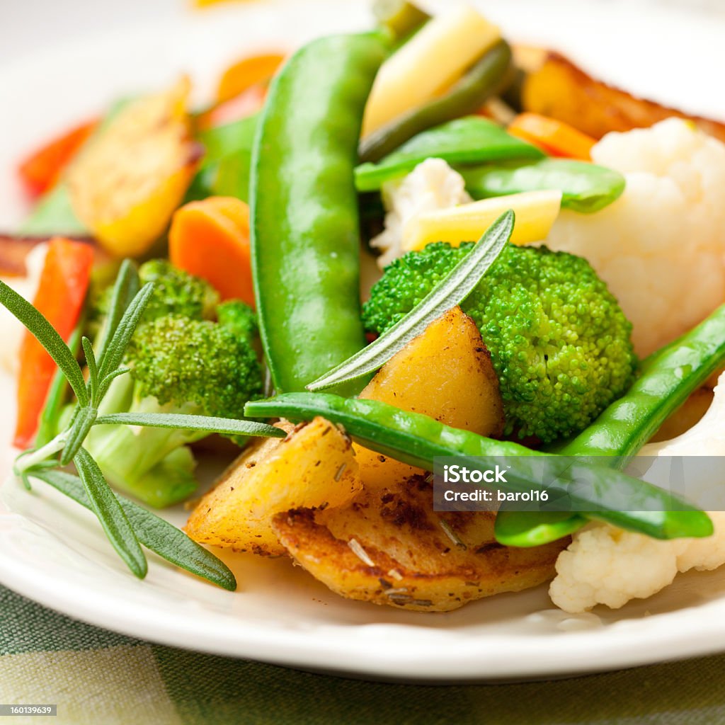 Stir-fried mixed vegetables on a plata Stir-fried mixed vegetables with rosemary  Broccoli Stock Photo