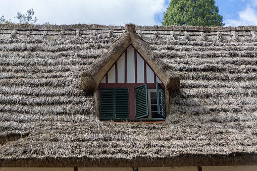 Detail view of a traditional thatched roof and window, used on traditional Madeira house, Levada do Caldeirão Verde and the Levada Caldeirão do inferno, Madeira Island, Portugal...