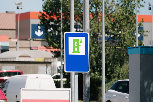 A sign announcing an electric car charger