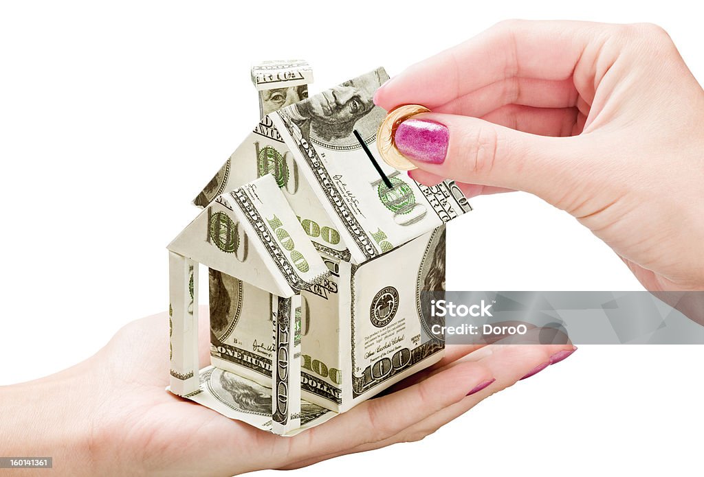 Save Money on a New House saving money on a new house isolated on white background Buying Stock Photo