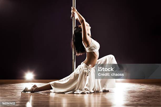 Woman Dressed In White Pole Dancing Stock Photo - Download Image Now - 20-29 Years, Adult, Adults Only