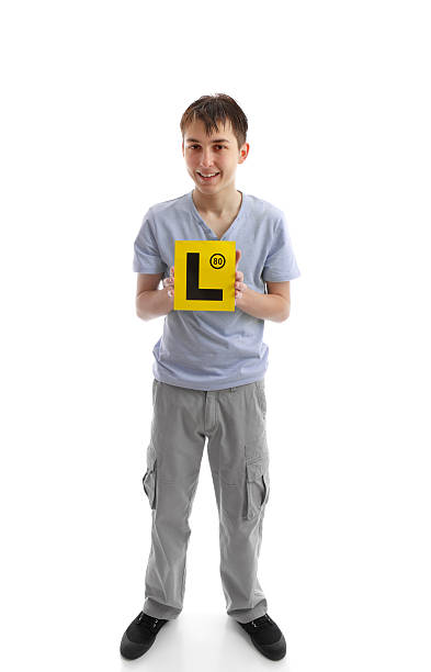 istock Teen boy holding L learner plates 160142320