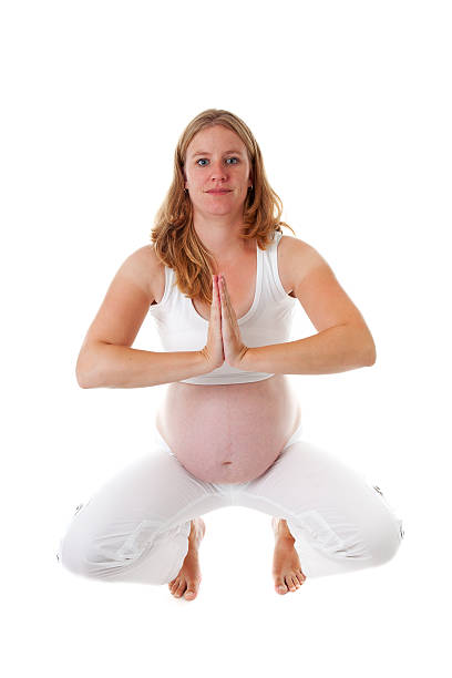 istock woman doing meditative pregnancy yoga 160142442