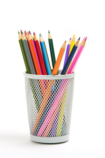 Color pencil stand in wire grid basket stock photo