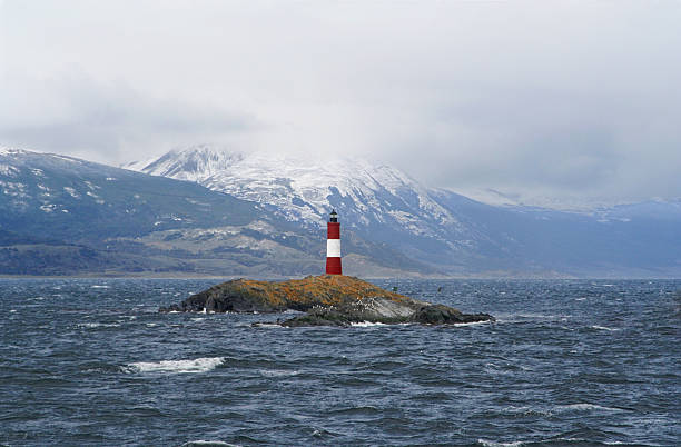 the lighthouse a view of a famous lighthouse on the beagle channel, near of ushuaia (tierra de fuego, patagonia) les eclaireurs lighthouse photos stock pictures, royalty-free photos & images