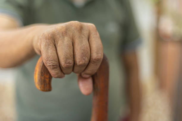 istock Cropped shot of an unrecognizable man leaning on his walking stick 1601432881