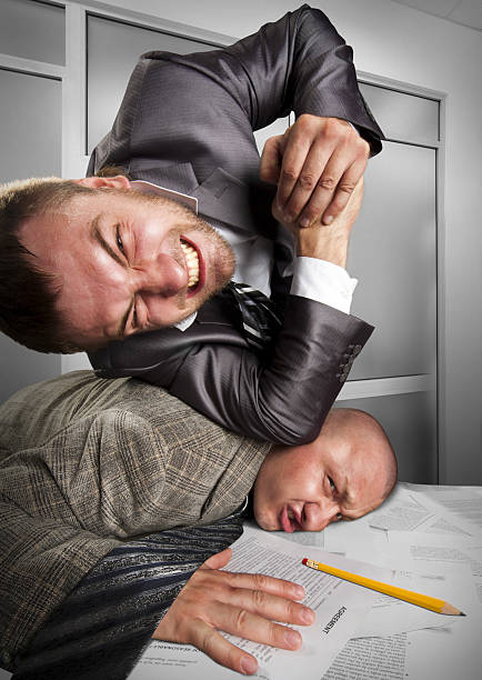 istock Businessmen fighting in the office 160144920