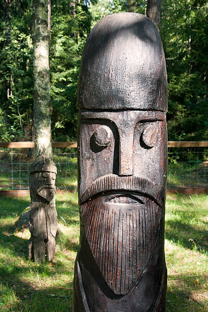 Thor Thor, son of Odin. God of thunder in the Scandinavian pantheon. Wooden idol in vikings village. Sweden totem pole face stock pictures, royalty-free photos & images
