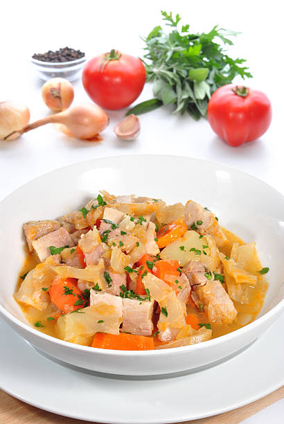 istock Cabbage soup with carrots, pork meat, potatoes and fresh herbs 160145127