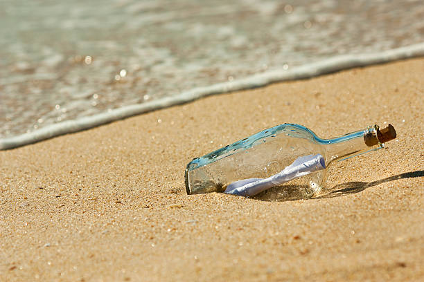 istock Found bottle with a message near the shore 160145278