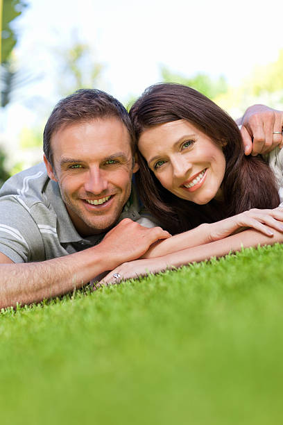 istock Couple lying down in the garden 160145291