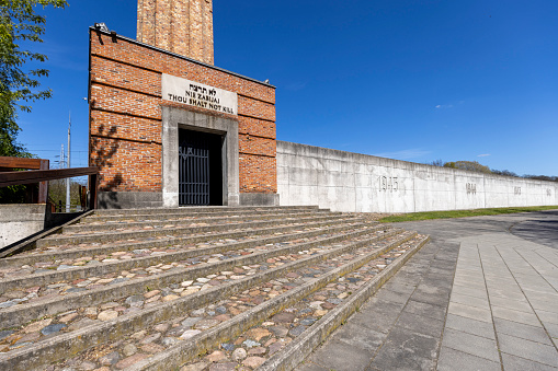 Lodz, Poland - May 4,2023: Radegast train station,  Memorial site for deported Jews to German Nazi concentration camps from Lodz ghetto (Litzmannstadt Ghetto). Symbolic crematorium chimney