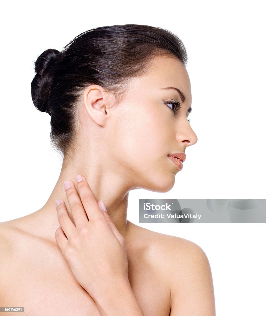 Woman stroking her skin on neck Beautiful young pretty woman stroking her skin on neck - isolated on white Cut Out Stock Photo