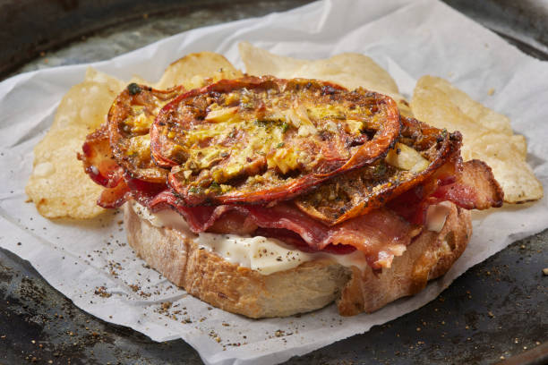 istock Open Faced Bacon Sandwich with Roasted Heirloom Tomatoes 1601464145